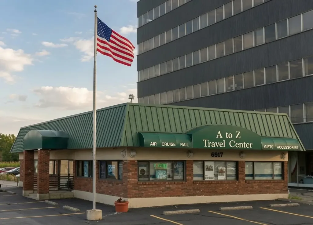 Exterior of A to Z Travel Center at 6917 West 130th Street in Parma Heights, Ohio, with green metal roof and American flag